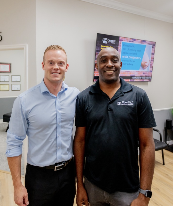 Dr. Jacob Henricksen and chiropractor patient taking photo together